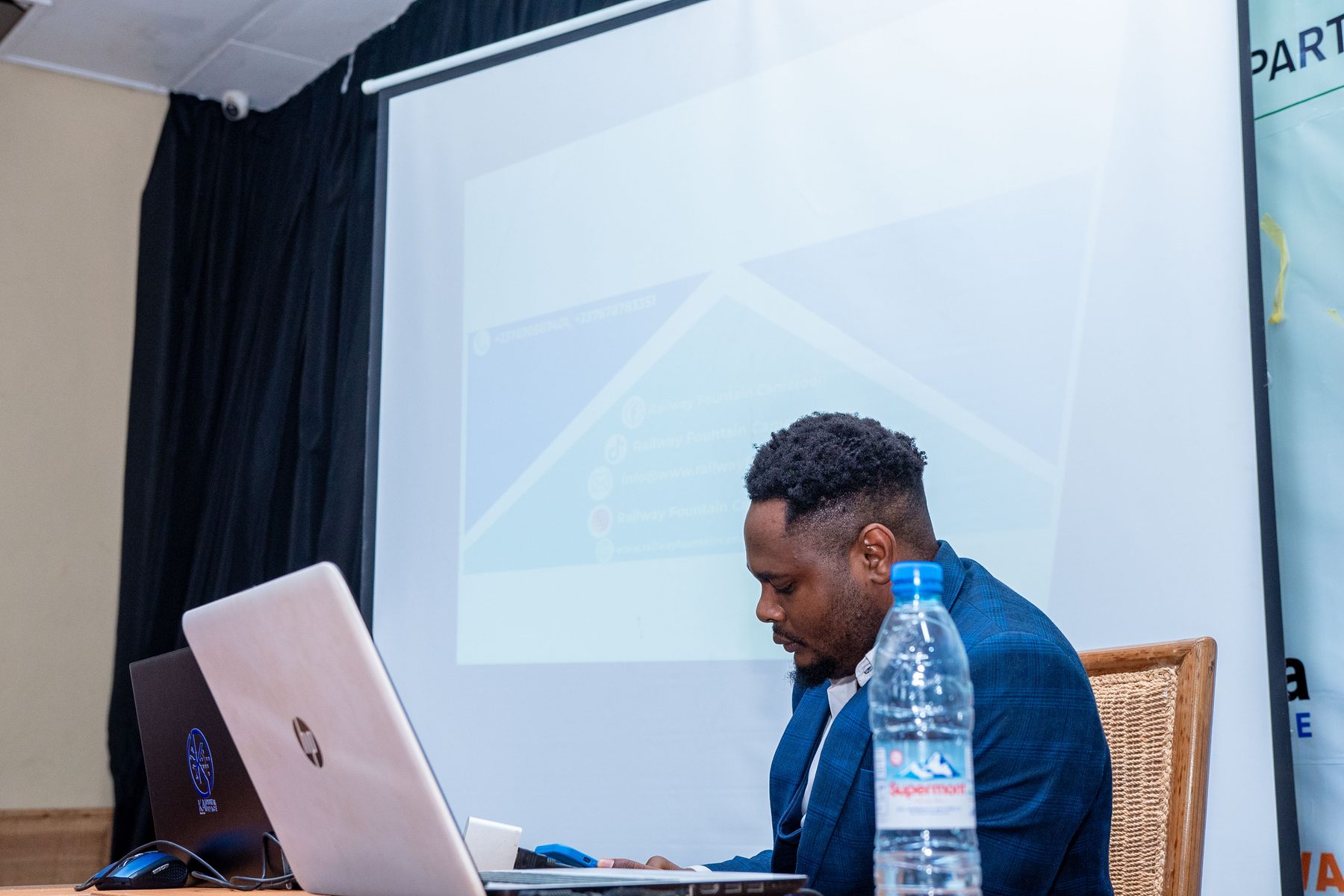 RFC team member in discussion with a prospective partner at the launch event